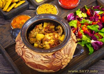 Утка с белыми грибами и картофелем в горшочках